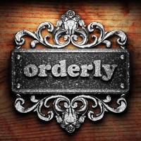 orderly word of iron on wooden background photo