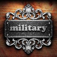 military word of iron on wooden background photo