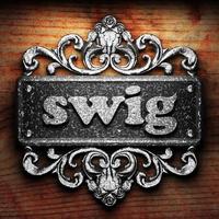 swig word of iron on wooden background photo