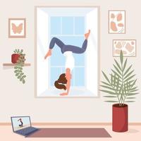 Woman does yoga in cozy modern interior. Online yoga lesson at home. Beautiful girl in sportswear performs handstand on windowsill. Stay at home concept