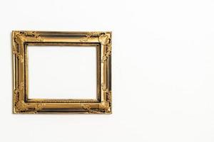 empty picture frame on white wall background photo