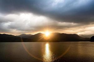 landscape Mountain with colorful vivid sunset on the cloudy sky photo