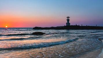 Khao Lak Light Beacon, beautiful sunset time at Nang Thong Beach , Khao Lak, Thailand. Tropical colorful sunset with cloudy sky . Patterns Texture of sand on the beach, Andaman sea Phang nga Thailand photo