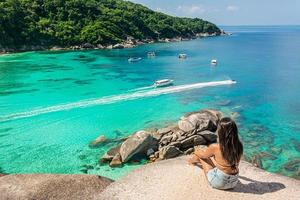 tourist looking panorama from Sail Rock View Point of Kor 8 of Similan Islands National Park, Phang Nga, Thailand, one of the tourist attraction of the Andaman Sea. photo