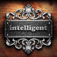 intelligent word of iron on wooden background photo