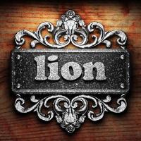 lion word of iron on wooden background photo
