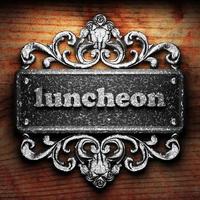 luncheon word of iron on wooden background photo