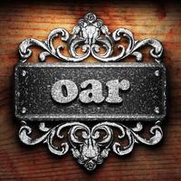 oar word of iron on wooden background photo