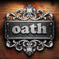 oath word of iron on wooden background photo