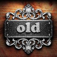 old word of iron on wooden background photo