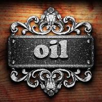 oil word of iron on wooden background photo