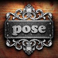 pose word of iron on wooden background photo