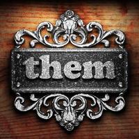 them word of iron on wooden background photo