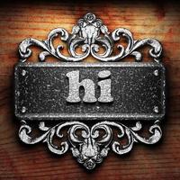 hi word of iron on wooden background photo