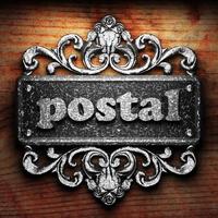 postal word of iron on wooden background photo