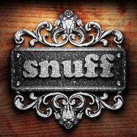 snuff word of iron on wooden background photo