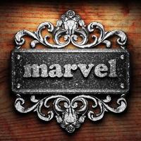 marvel word of iron on wooden background photo