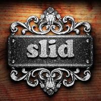 slid word of iron on wooden background photo
