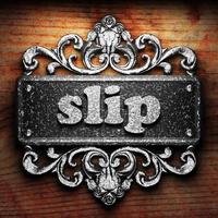 slip word of iron on wooden background photo