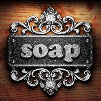 soap word of iron on wooden background photo