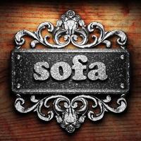 sofa word of iron on wooden background photo