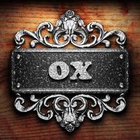 ox word of iron on wooden background photo