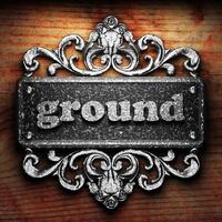 ground word of iron on wooden background photo