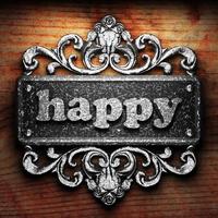 happy word of iron on wooden background photo