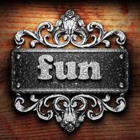 fun word of iron on wooden background photo