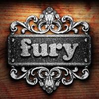 fury word of iron on wooden background photo