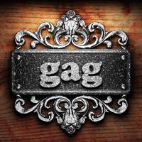 gag word of iron on wooden background photo