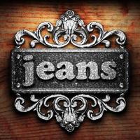 jeans word of iron on wooden background photo