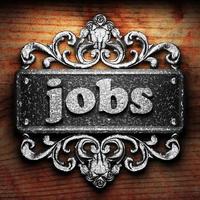 jobs word of iron on wooden background photo