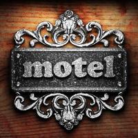 motel word of iron on wooden background photo