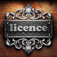 licence word of iron on wooden background photo