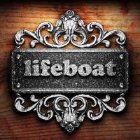 lifeboat word of iron on wooden background photo