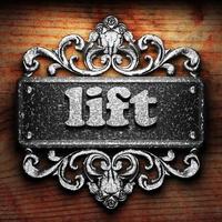 lift word of iron on wooden background photo