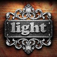 light word of iron on wooden background photo