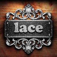 lace word of iron on wooden background photo