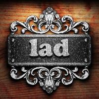 lad word of iron on wooden background photo