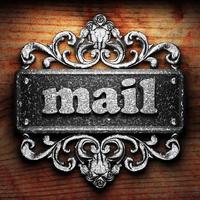 mail word of iron on wooden background photo