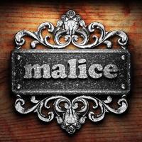 malice word of iron on wooden background photo