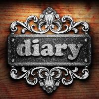 diary word of iron on wooden background photo