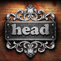 head word of iron on wooden background photo