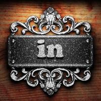 in word of iron on wooden background photo