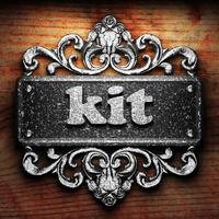 kit word of iron on wooden background photo