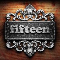 fifteen word of iron on wooden background photo