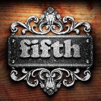 fifth word of iron on wooden background photo