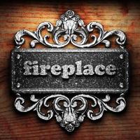 fireplace word of iron on wooden background photo