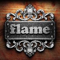 flame word of iron on wooden background photo